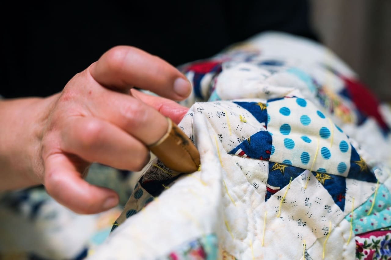 Quilter sewing with custom printed fabric