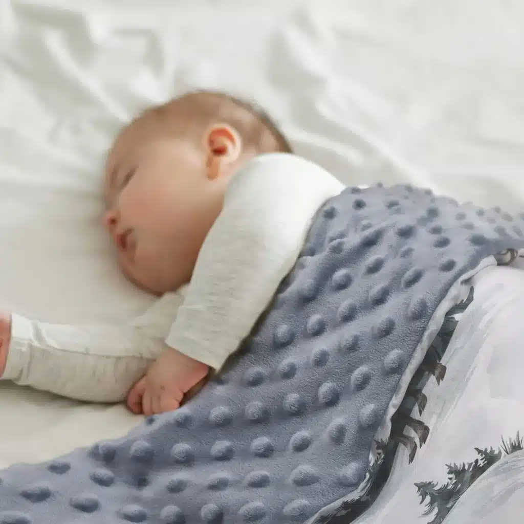 minky baby blanket used in crib for newborn sleep