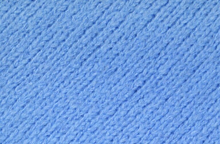 Soft cotton fleece fabric texture close-up, showing brushed surface and cozy feel