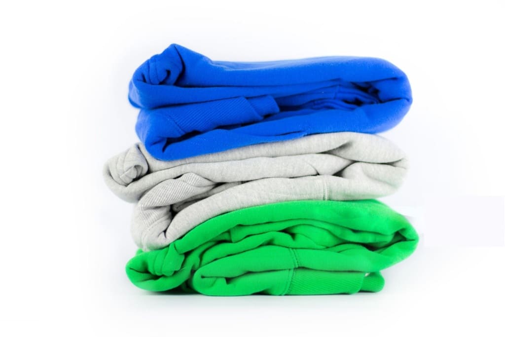Cotton fleece hoodies and blankets showcasing everyday applications of brushed fleece fabric