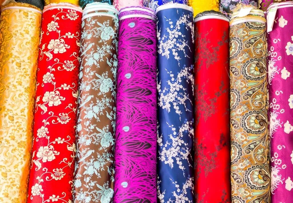 shiny satin print fabric rolls with floral patterns