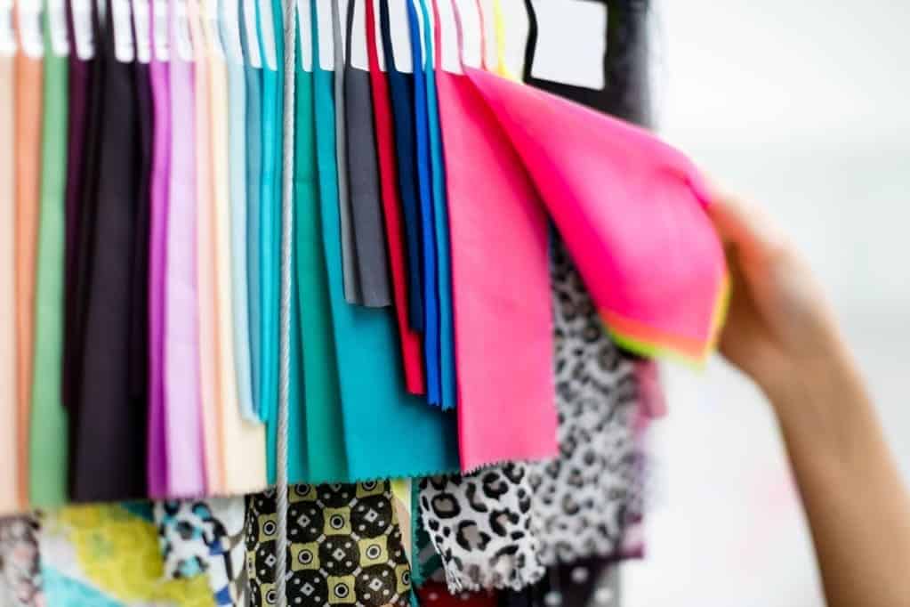 Polyester vs spandex fabric comparison showing texture and stretch differences