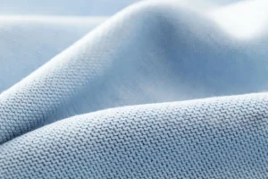 Cotton interlock fabric texture showing smooth double knit structure