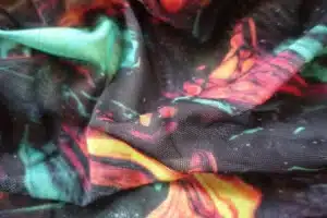 Printed mesh fabric with digital textile printing on sheer material