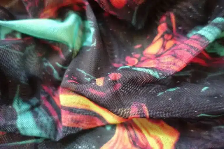 Printed mesh fabric with digital textile printing on sheer material