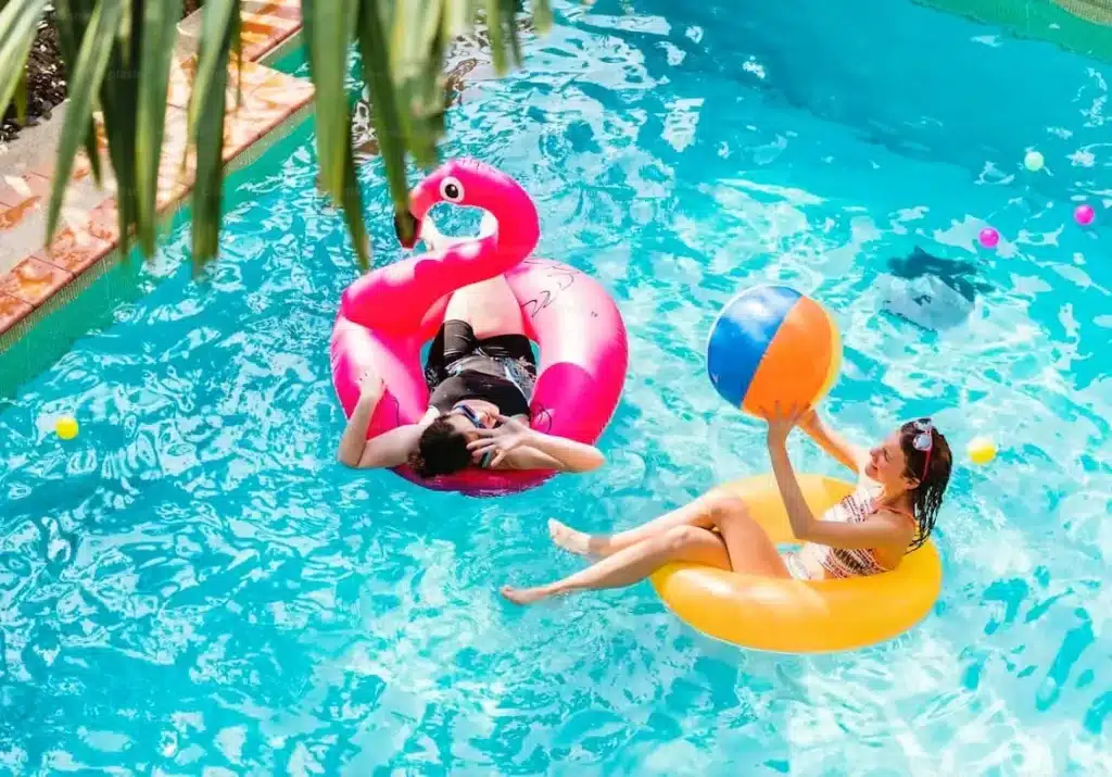 Active beachgoers wearing SPF50+ swimwear for maximum UV protection
