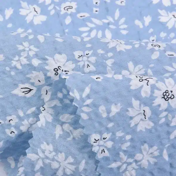 Cotton Stripe Voile Fabric used as a stylish tablecloth for a dining setting