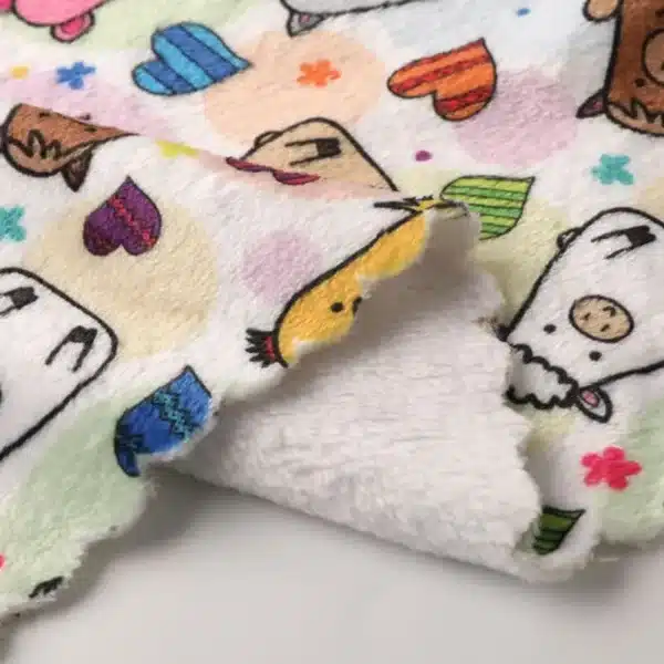 Cozy home décor items like blankets and cushions made from Polyester Flannel fabric