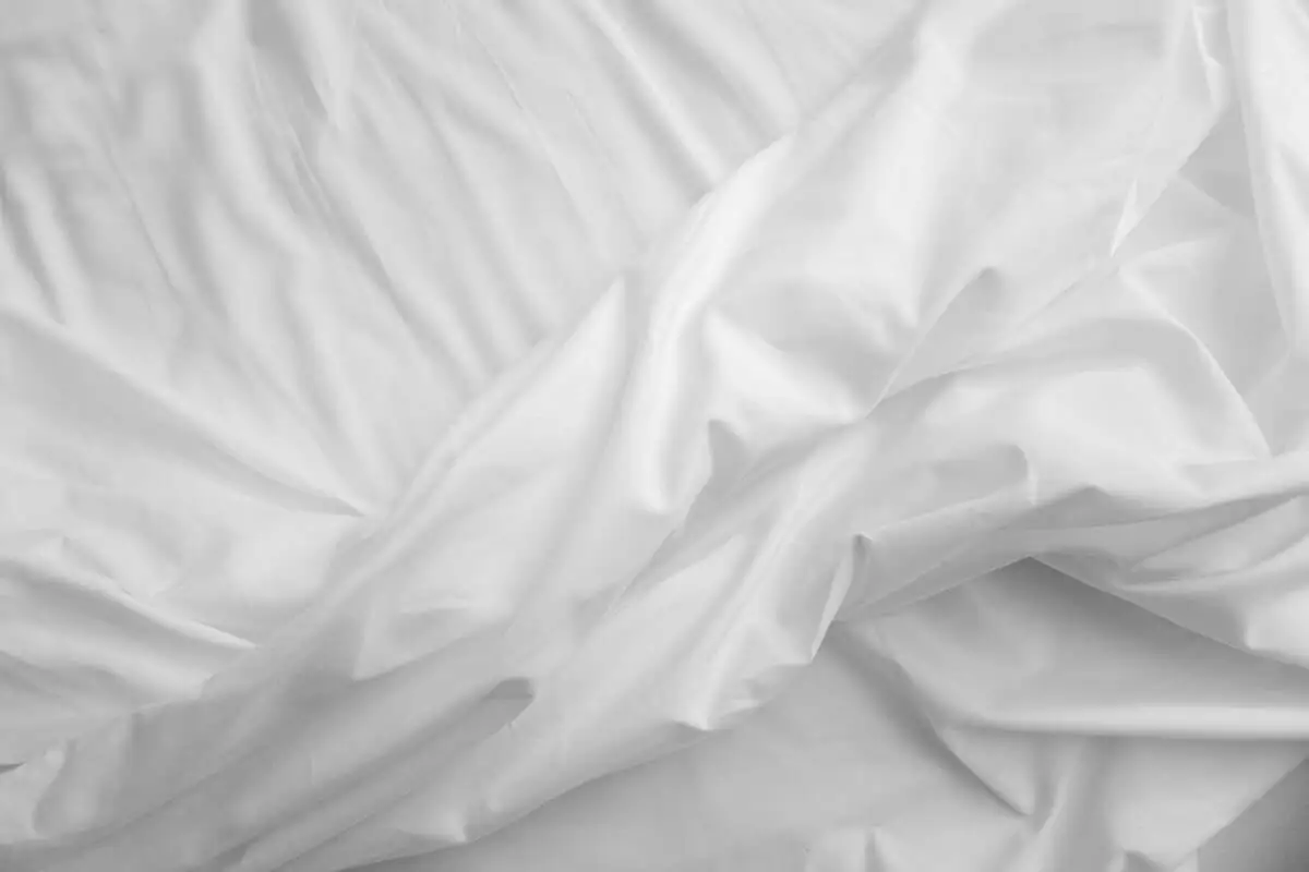 Close-up view of cotton sateen fabric showing soft texture and smooth surface