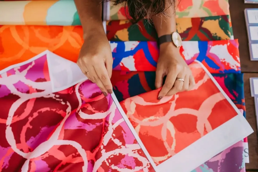 Heat press transferring artwork on fabric