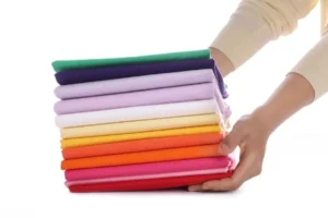 Cotton poplin fabric by the yard close-up showing smooth and breathable textile texture