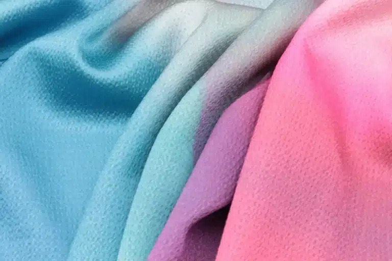 Close-up view of microfiber fabric by the yard showing soft texture and smooth surface for custom textile printing