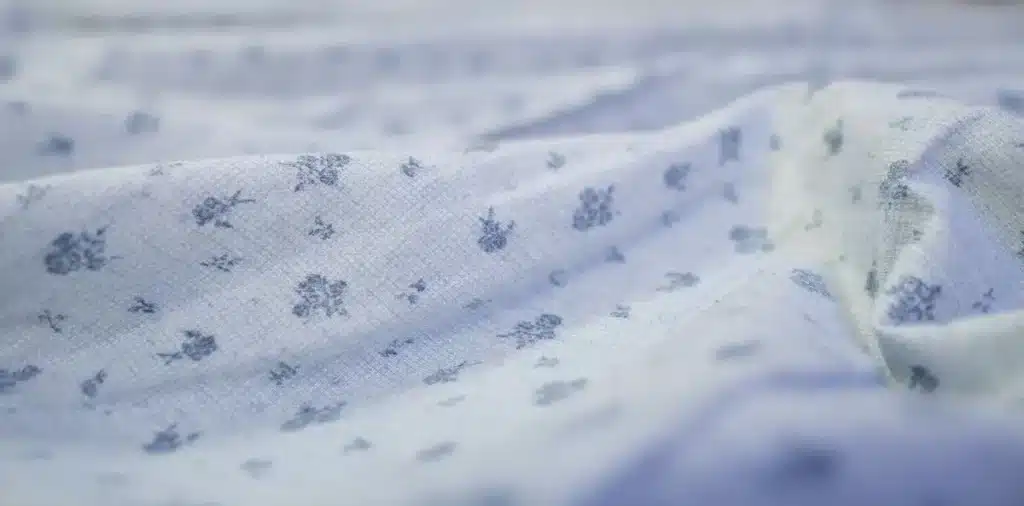 Close-up of printed linen fabric highlighting natural texture and patterns