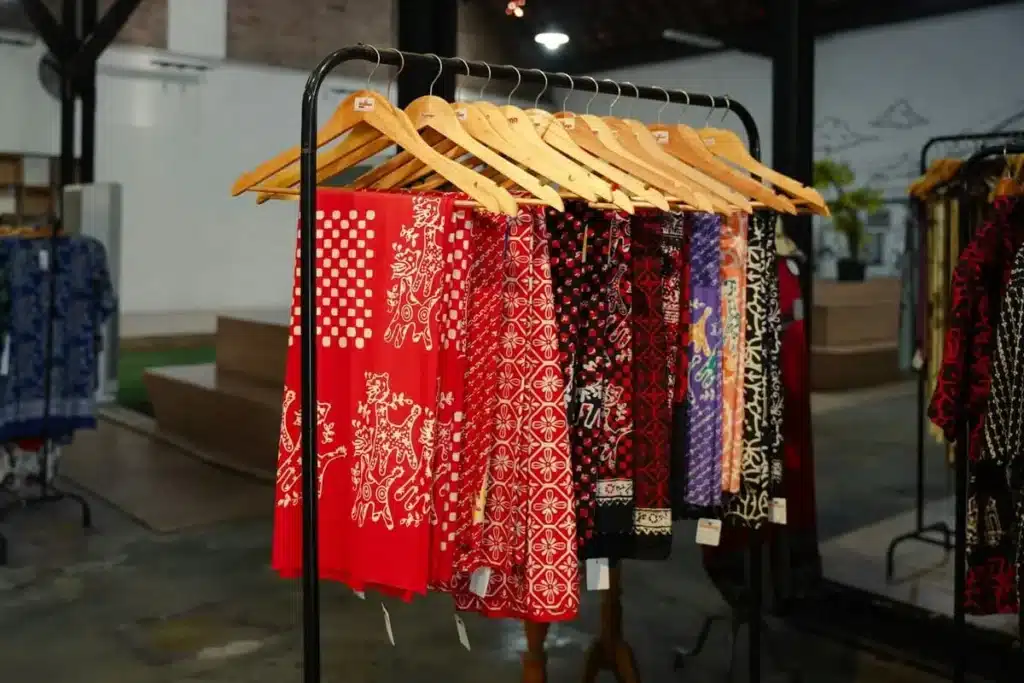 Printed satin fabric with glossy surface and vibrant colors used for fashion dresses and luxury garments