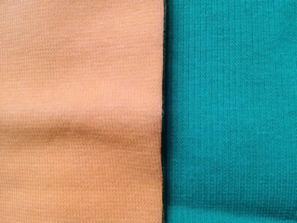 Close up texture of single jersey fabric showing soft knitted cotton surface