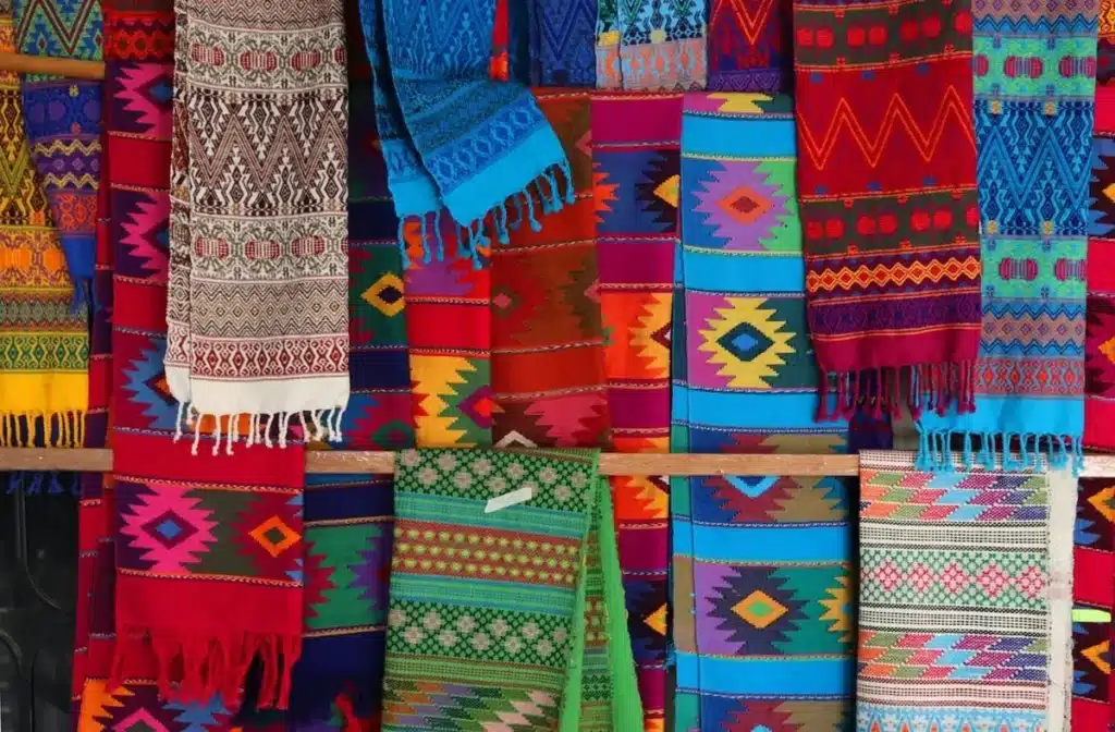 Custom printed acrylic fabric applications including sweaters scarves blankets hats and accessories
