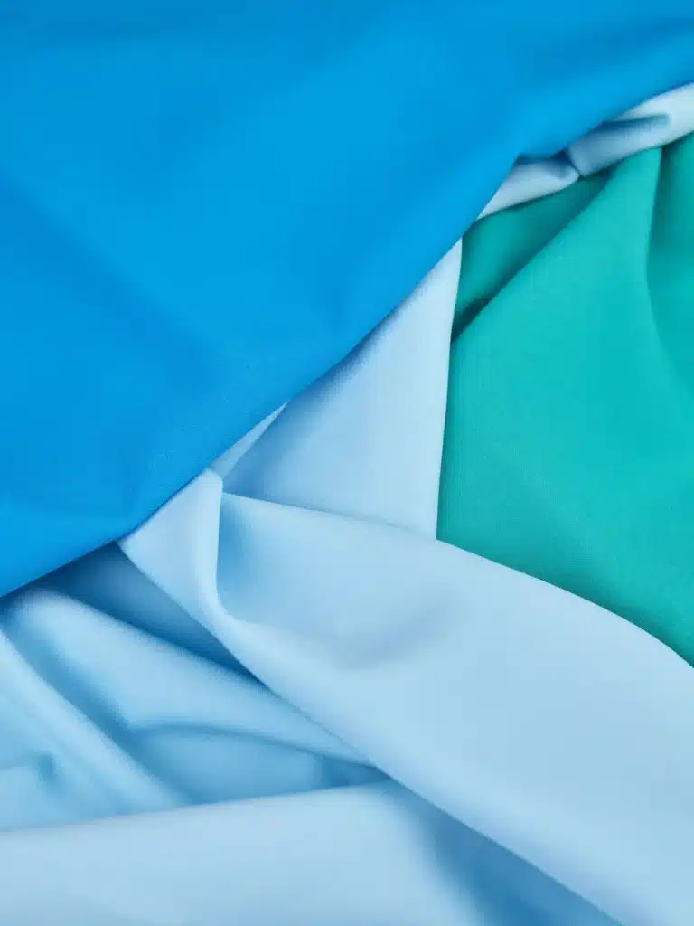 Different types of polyester fabrics for custom printing including stretch and recycled polyester