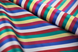 Custom striped fabric printing with navy white and multicolor stripe patterns on textile